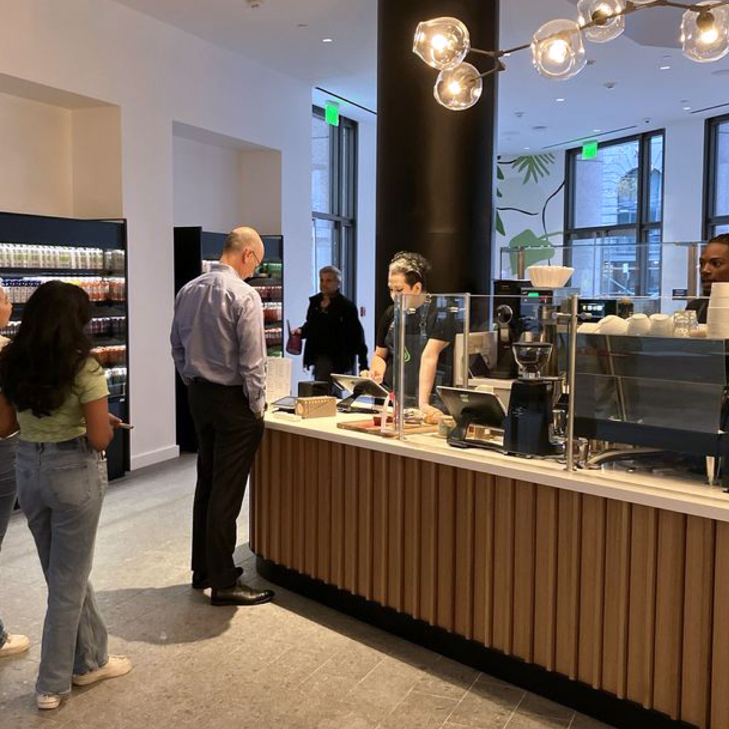 Guests ordering at cafe counter